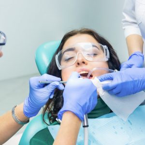 dentists-are-working-with-patient-e1617040255996