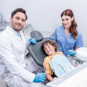 dentists-preparing-little-boy-for-examining-teeth-at-dentist-office-1536x1025
